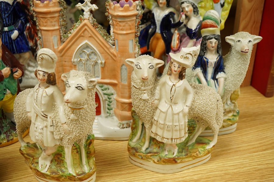 A collection of Victorian Staffordshire pottery figures, largest 32cm high